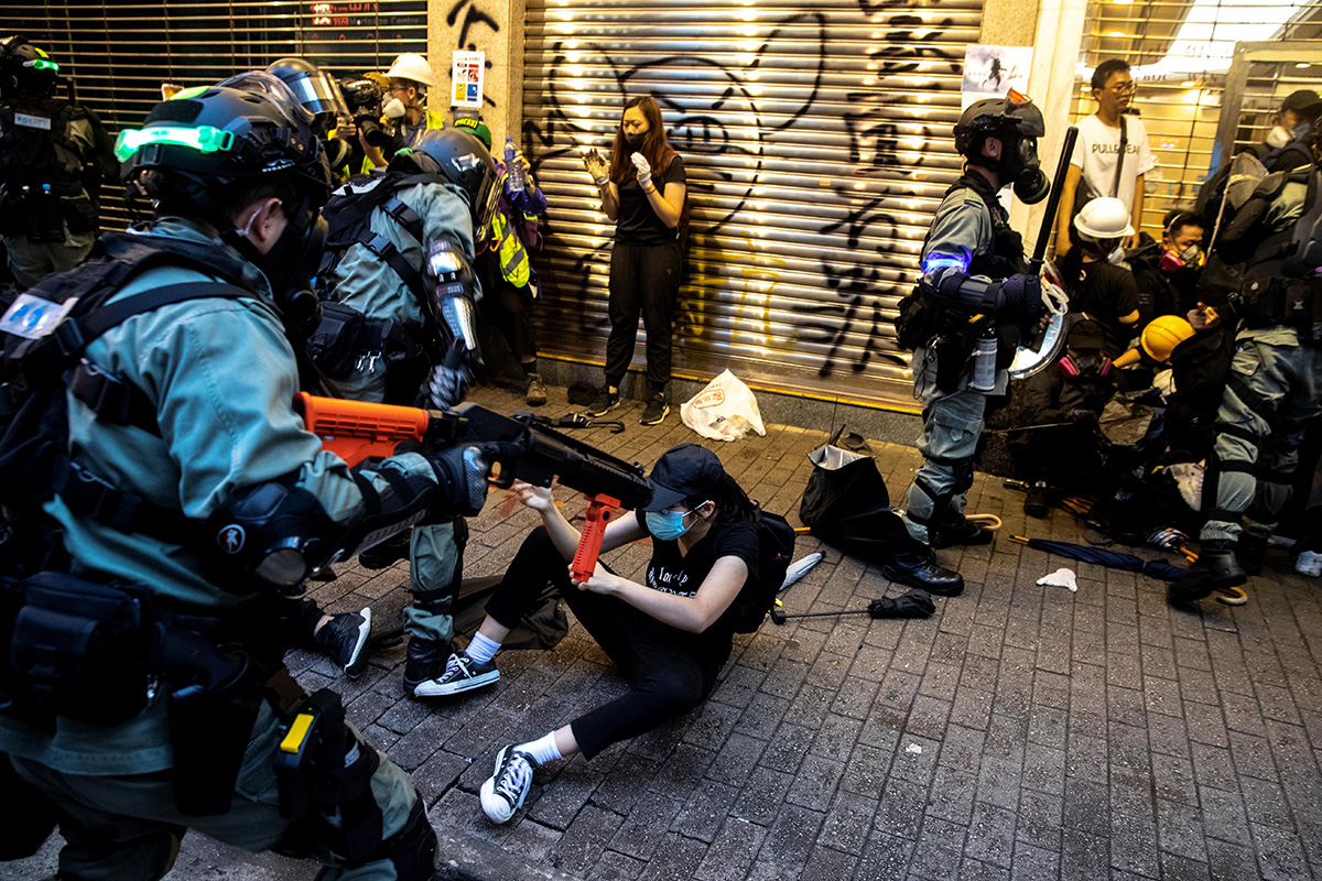 Riot police officers clash with anti-government protesters during a demonstration in Causeway Bay district in Hong Kong, China, on 6 October 2019.