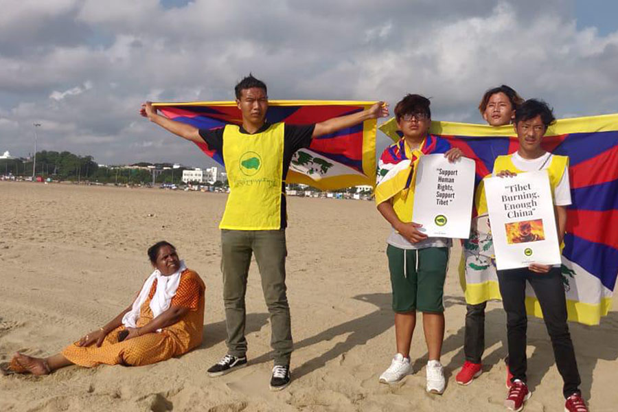 Members of the Tibetan Youth Congress staging a protest on the beach of Mahabalipuram, India, on 10 October 2019. 