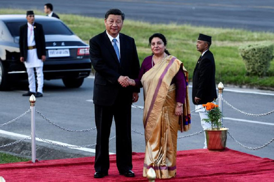 Nepal's President Bidhya Devi Bhandari shakes hands with China's President Xi Jinping during a welcome ceremony at the Tribhuvan International Airport in Kathmandu, Nepal, on 12 October  2019.