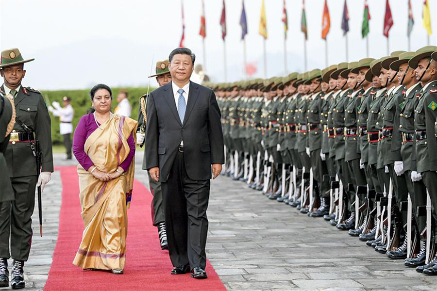 Chinese President Xi Jinping, accompanied by Nepalese President Bidya Devi Bhandari, reviews the guard of honour during a welcome ceremony held at Tribhuvan International Airport in Kathmandu, Nepal, on 12 October 2019. Xi Jinping arrived in Kathmandu on Saturday for a state visit to Nepal.