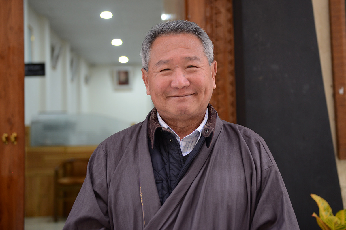 Kalsang Phuntsok poses for a photo outside the Tibetan Supreme Justice Commission in Dharamshala, India, on 21 November 2019.