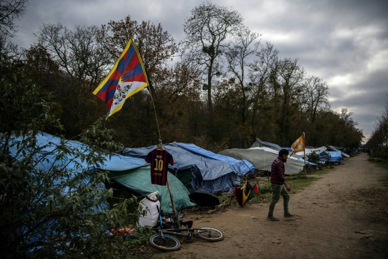 The makeshift camp set up by Tibetan asylum seekers near a forest in Acheres, northwest of Paris.