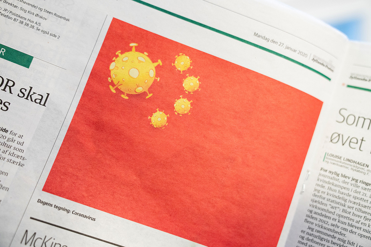 A cartoon of the coronavirus depicted as part of the Chinese national flag, is pictured in the Danish newspaper Jyllands-Posten's Monday, 27 January 2020 edition, in Copenhagen, Denmark.