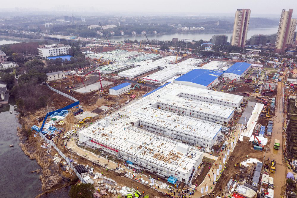 The Huoshenshan temporary field hospital under construction is seen as it nears completion in Wuhan in central China's Hubei Province, on 2 February 2020. The Philippines on Sunday reported the first death from a new virus outside of China, where authorities delayed the opening of schools in the worst-hit province and tightened quarantine measures in a city that allow only one family member to venture out to buy supplies.