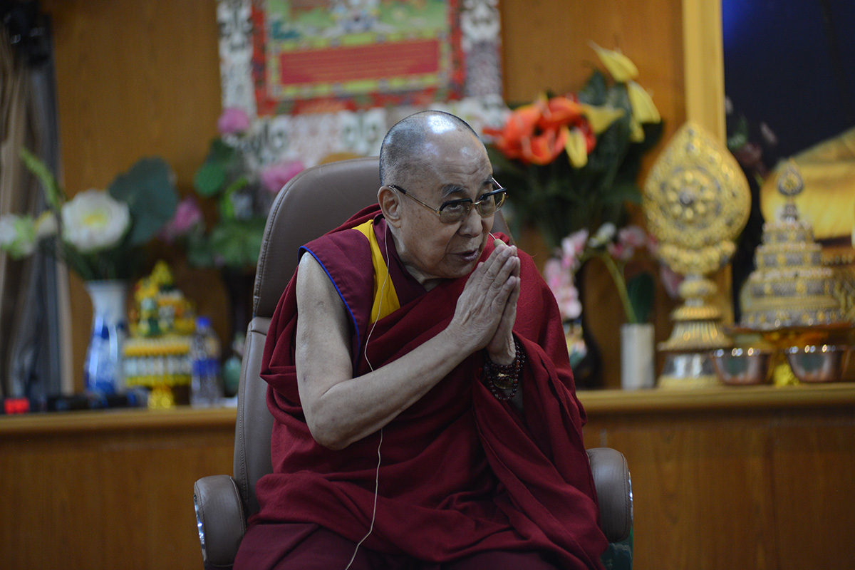 Tibetan spiritual leader the Dalai Lama gestures as he interacts with members of the press during an event in McLeod Ganj, India, on 25 October 2019.