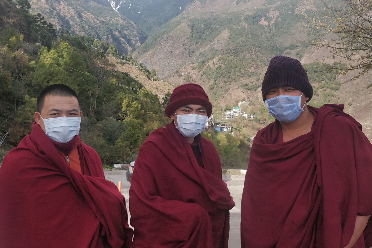 Tibetan Buddhist monks wearing face masks to protect from coronavirus are seen in McLeod Ganj, India, on 7 March 2020.