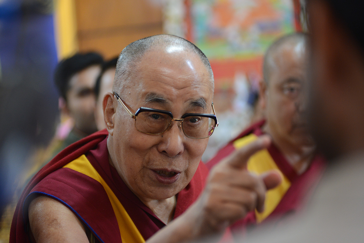 Tibetan spiritual leader the Dalai Lama gestures as he speaks to members of the press at his residence in McLeod Ganj, India, on 25 October 2019.