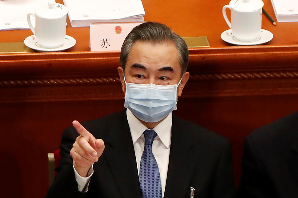 Chinese Foreign Minister Wang Yi wearing a face mask following the coronavirus disease (COVID-19) outbreak attends the opening session of the National People's Congress (NPC) at the Great Hall of the People in Beijing, China, on 22 May 2020.