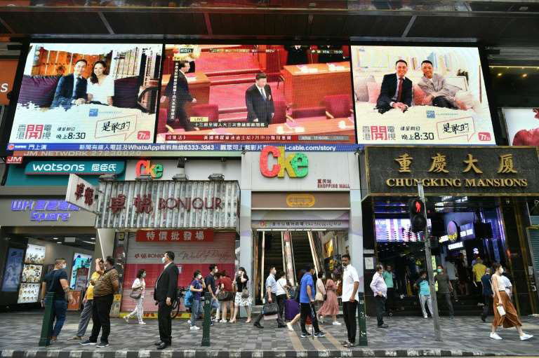 China's President Xi Jinping is shown on a large video screen in Hong Kong -- a new national security law for the city has raised hackles in the territory and abroad.