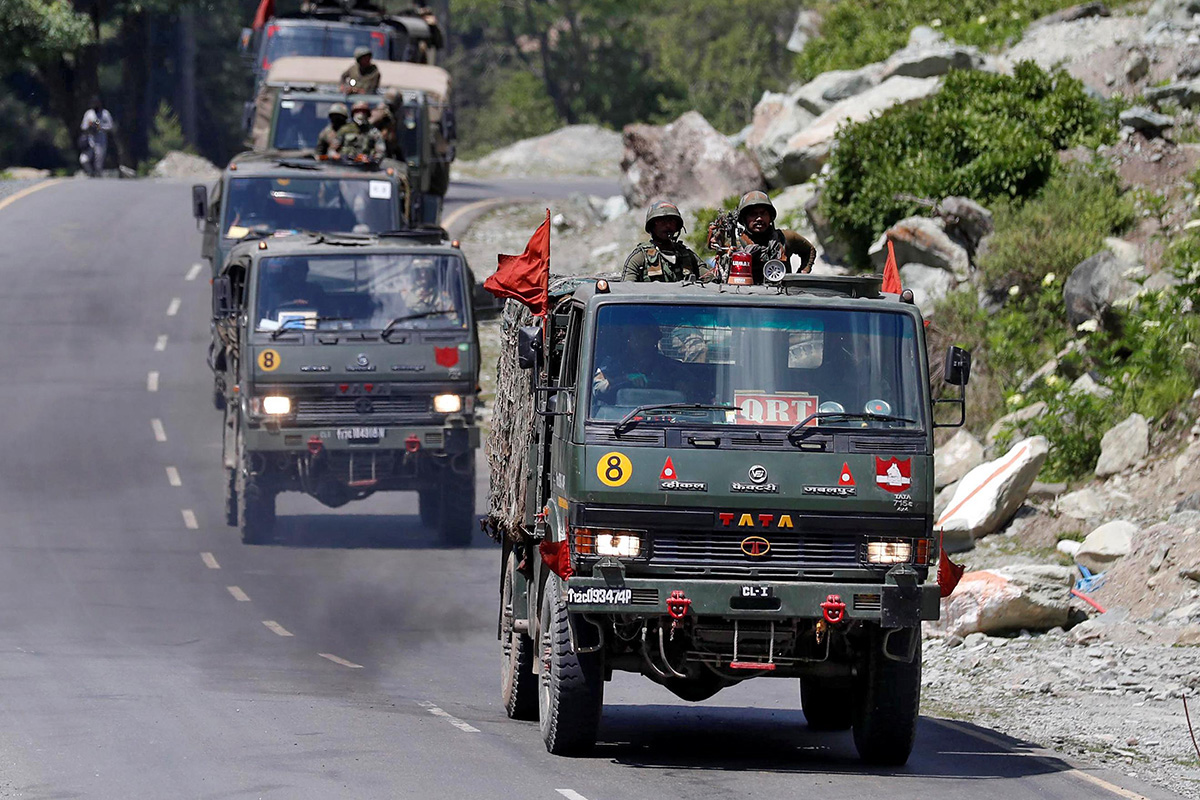 An Indian Army convoy moves along a highway leading to Ladakh, at Gagangeer in Kashmir's Ganderbal district on 18 June 2020.