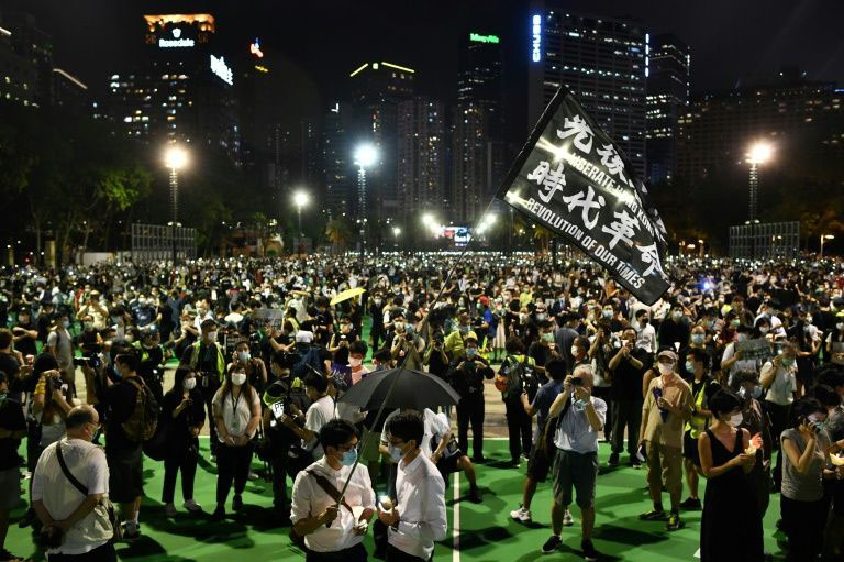 Thousands in Hong Kong defied a ban on gathering to commemorate the Tiananmen crackdown.
