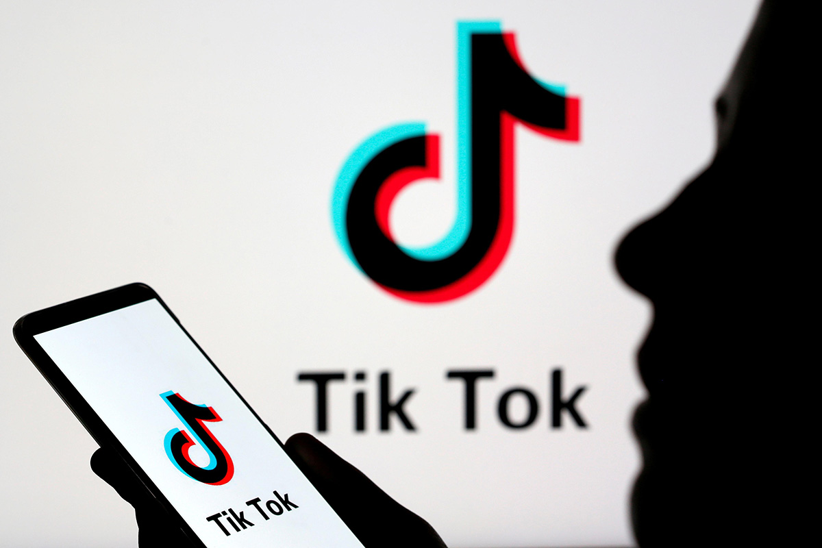 A person holds a smartphone with Tik Tok logo displayed in this picture illustration taken on 7 November 2019.