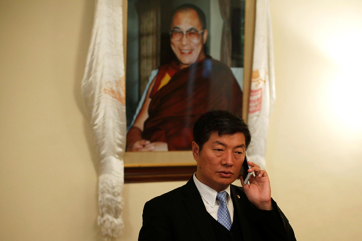 Lobsang Sangay, Prime Minister of the Tibetan government-in-exile, speaks on his mobile phone before an interview with Reuters in New Delhi, India, on 16 December 2016.