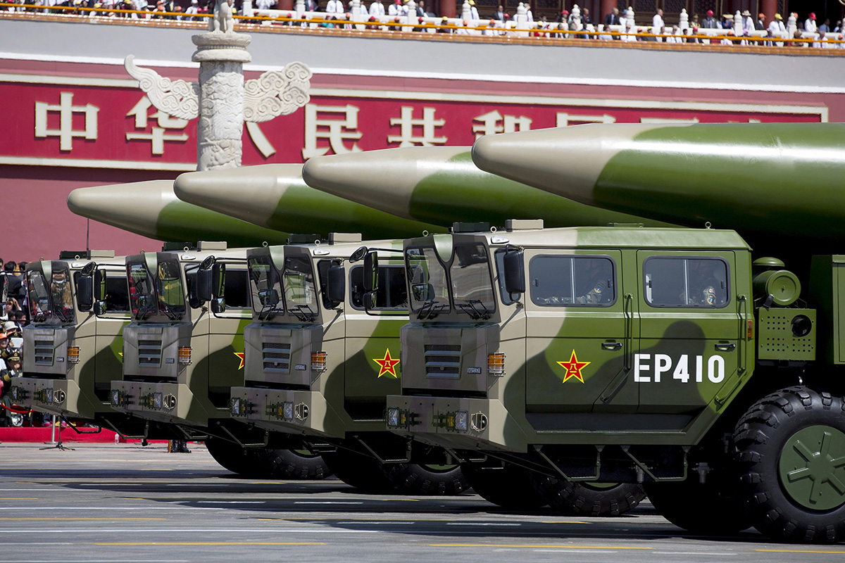 Military vehicles carrying DF-26 ballistic missiles travel past Tiananmen Gate during a military parade to commemorate the 70th anniversary of the end of World War II in Beijing on 3 September 2015. A DF-26 missile was from Qinghai into the South China Sea on 25 August 2020, according to a source close to the Chinese military.