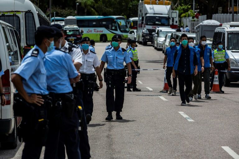 Police in Hong Kong cordoned off the street outside the Next Media offices after the arrest of media tycoon Jimmy Lai.