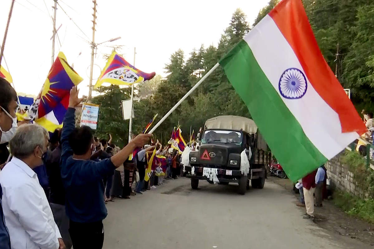 Members of the Tibetan community cheer in support for the Special Frontier Force (SFF) soldiers as they leave for India-China border in Himachal Pradesh and Ladakh, in Shimla, India, on 4 September 2020.