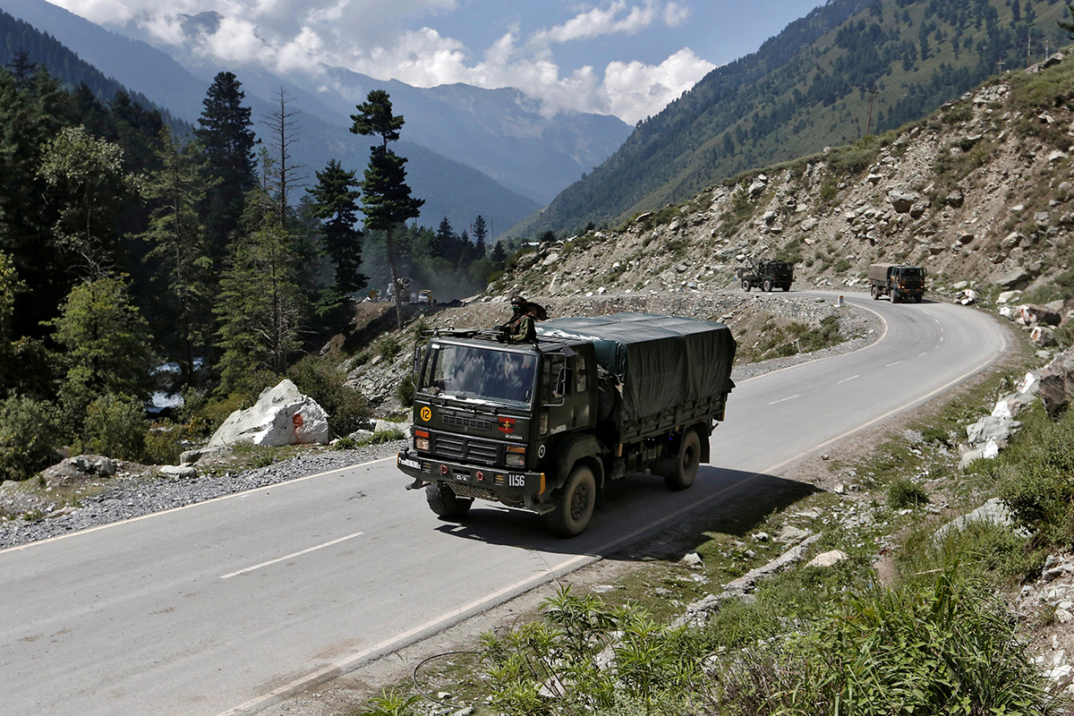 Indian army trucks move along a highway leading to Ladakh, at Gagangeer in Kashmir's Ganderbal district on 3 September 2020.