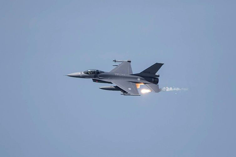 A US-made F-16V fighter releases flares during a Taiwan military drill. Taipei says the US sale of air-to-ground missiles will build its combat capabilities.