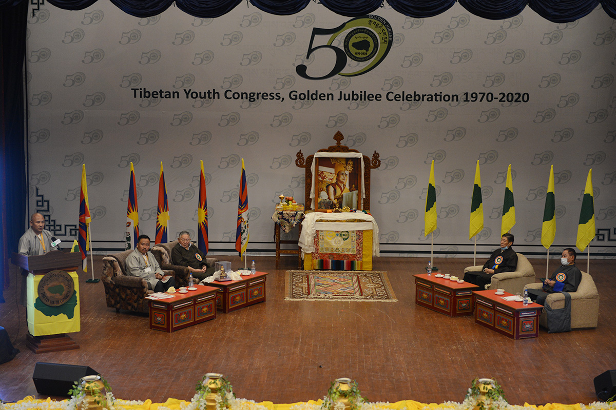 Tibetan Youth Congress celebrating 50-year milestone with the first President Tenzin Geyche Tethong (3rd left) as the chief guest, at the TIPA auditorium in McLeod Ganj, India, on 7 October 2020. Vice President Lobsang Tsering speaks as President Gonpo Dhondup (2nd left), former president and Supreme Justice Commissioner Sonam Norbu Dagpo (2nd right), and Speaker of the Tibetan Parliament-in-exile Pema Jungney look on.