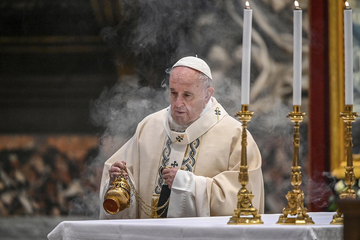 In this 22 November 2020, file photo, Pope Francis incenses the altar as he celebrates Mass on the occasion of the Christ the King festivity, in St Peter's Basilica at the Vatican. China criticized Pope Francis on Tuesday over a passage in his new book in which he mentions suffering by China’s Uyghur Muslim minority group.