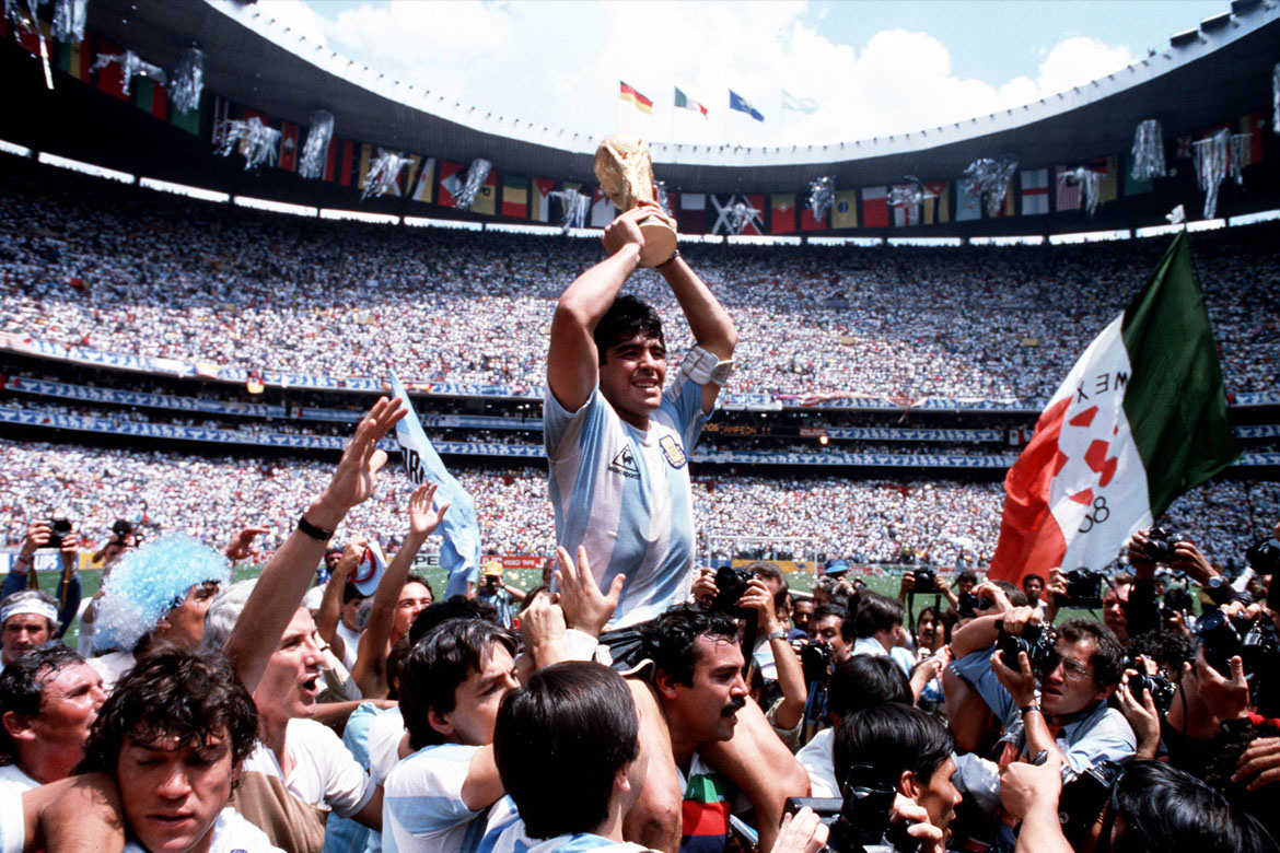 Diego Maradona, one of the all-time ultimate legends of football, has died at the age of 60, pictured lifting the World Cup in 1986 after Argentina beating West Germany 3–2 in the final at Mexico City's  Azteca Stadium.