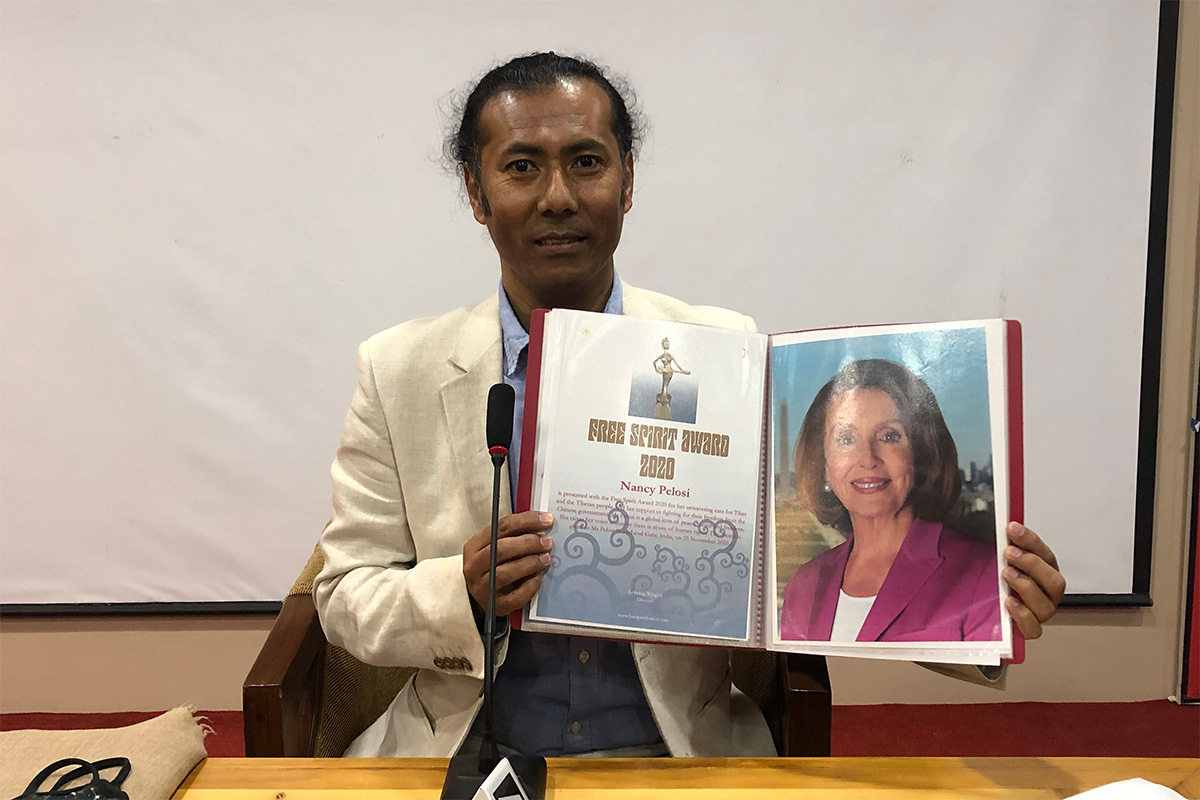 Free Spirit Award 2020 presented to Nancy Pelosi, Speaker of the United States House of Representatives, in McLeod Ganj, India, on 25 November 2020. Lobsang Wangyal, the Director of the Free Spirit Awards, holding the certificate with an inscription summing up the work of the distinguished receiver. 