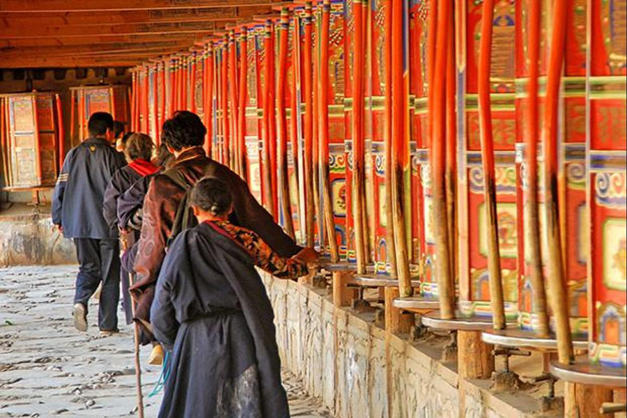 Tibetans spin prayer wheels at Labrang Monastery in Tibet's Amdo province, China.