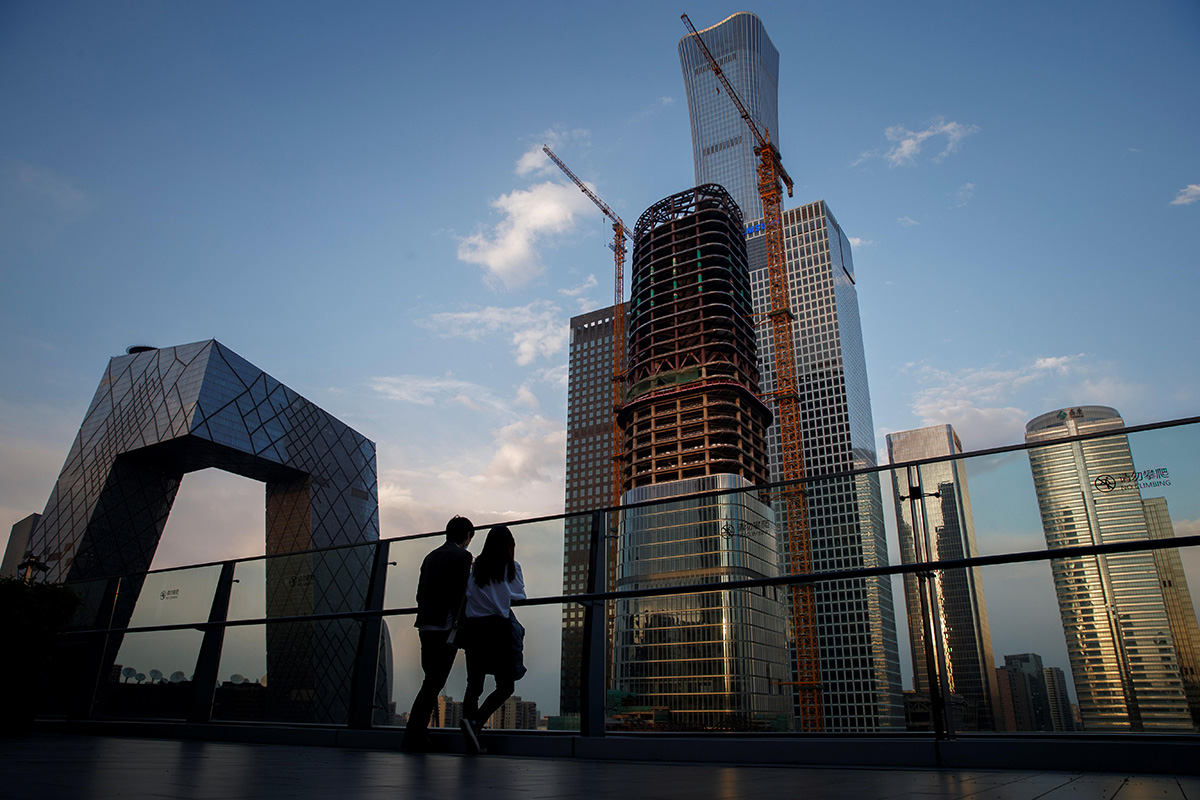 People look at the skyline of the Central Business District in Beijing, China, on 16 April 2020.