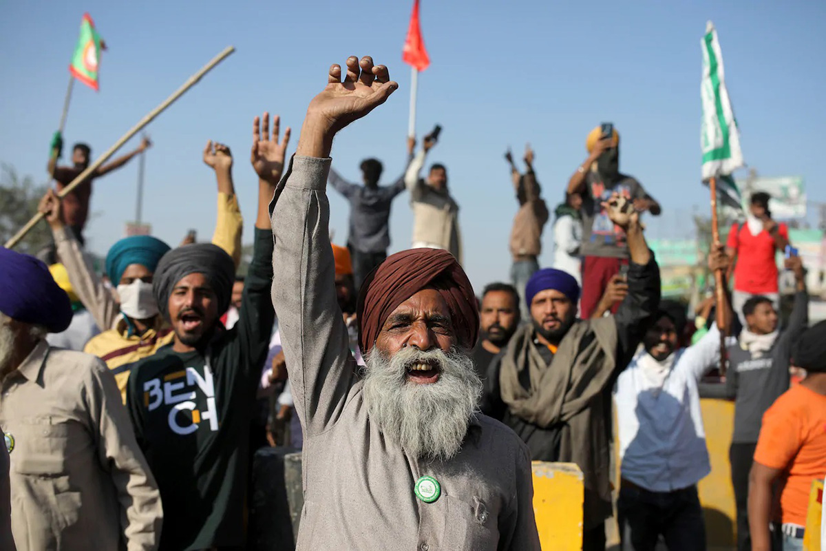 Protesting farmers shout slogans as they clash with police while attempting to move toward New Delhi.