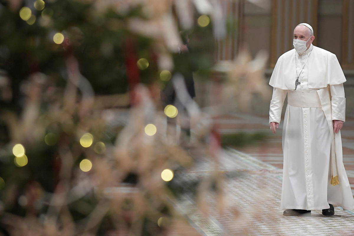 Pope Francis wears a protective mask before delivering his traditional Christmas Day Urbi et Orbi speech to the city and the world virtually from inside the Hall of Blessings instead of from the St Peter's square in order to limit the number of people gathering due to the coronavirus disease (COVID-19) regulations, at the Vatican, on 25 December 2020.
