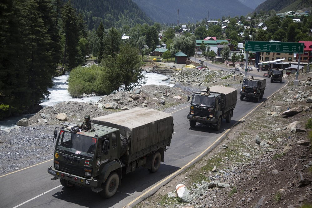 An Indian army convoy moves on the Srinagar-Ladakh highway at Gagangeer, north-east of Srinagar, India, on 17 June 2020.