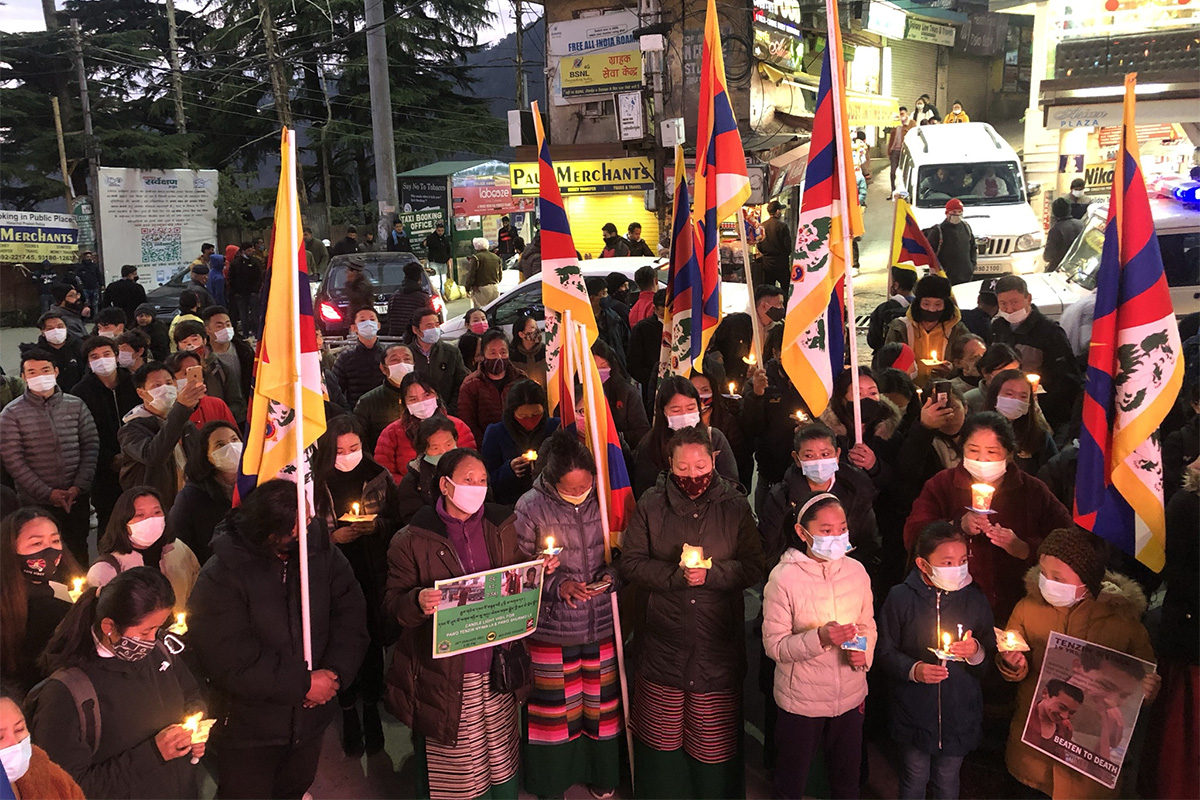 Exile Tibetans participate in a candlelight vigil to mourn the death of teenager monk Tenzin Nyima (aka Tamey) at the Main Square in McLeod Ganj, India, on 25 January 2021.