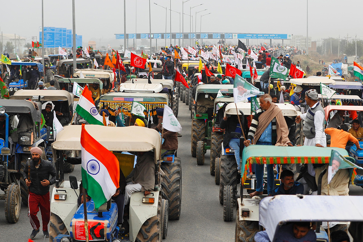 Farmers participate in a tractor rally to protest against the newly passed farm bills, on a highway on the outskirts of New Delhi, India, on 7 January 2021.