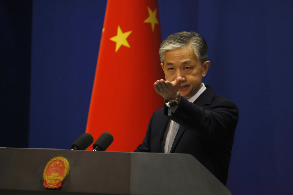 Foreign Ministry spokesperson Wang Wenbin gestures for questions during the daily briefing in Beijing on 23 July 2020.