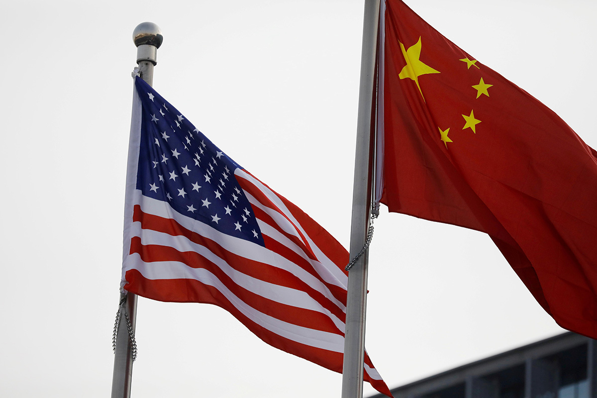 Chinese and US flags flutter outside the building of an American company in Beijing, China, on 21 January 2021.