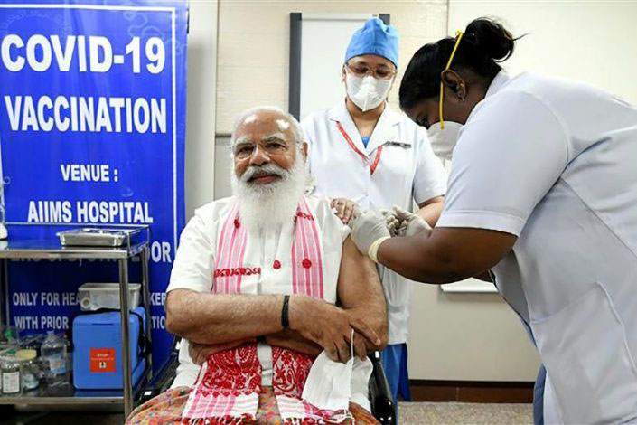 Modi received a domestic developed vaccine, Covaxin, in a carefully choreographed operation at the AIIMS national medical institute.