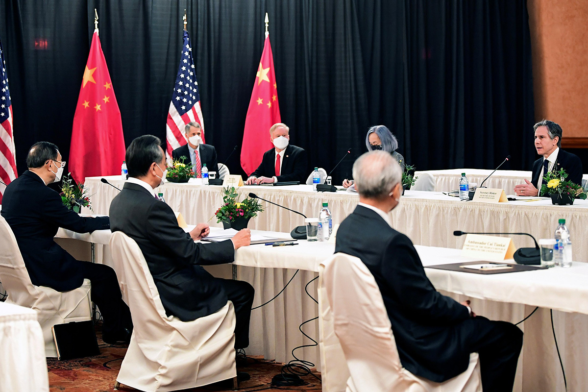 US Secretary of State Antony Blinken (R) speaks while facing Yang Jiechi (L), director of the Central Foreign Affairs Commission Office, and Wang Yi (2nd L), China's State Councilor and Foreign Minister, at the opening session of US-China talks at the Captain Cook Hotel in Anchorage, Alaska, US, on 18 March 2021.