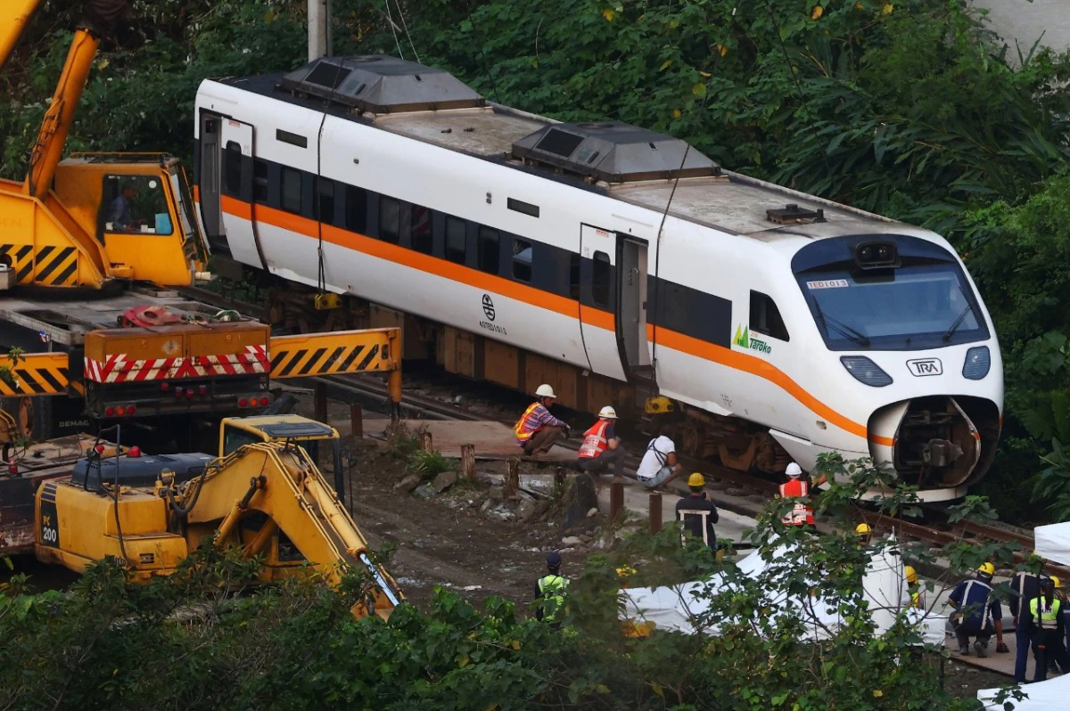 Rescuers work at the site a day after a deadly train derailment at a tunnel north of Hualien, Taiwan, on 3 April 2021.