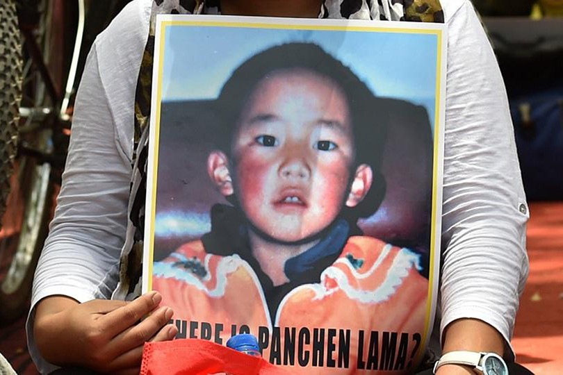 A Tibetan living in exile takes part in a rally in New Delhi on 23 May 2016 in support of the Panchen Lama, Tibetan Buddhism's second most important spiritual leader. Gedhun Choekyi Nyima disappeared into Chinese custody in 1995 at the age of six after being chosen by the Dalai Lama, and has not been seen since.