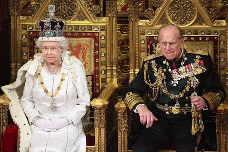 Britain's Queen Elizabeth waits to read the Queen's Speech to lawmakers in the House of Lords, next to Prince Philip, during the State Opening of Parliament in central London, on 9 May 2012.