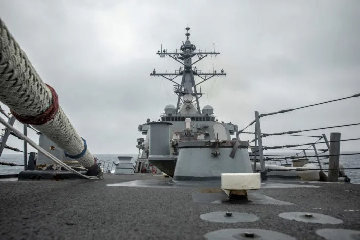 In this photo released by the US Navy, the US Arleigh Burke-class guided-missile destroyer USS Curtis Wilbur (DDG 54) conducts routine operations in the Taiwan Strait, on 18 May 2021. China on Thursday, 20 May 2021, issued its second protest in as many days over United States naval activity in the region, drawing an unusually sharp response from the US 7th Fleet, which accused Beijing of attempting to assert illegitimate maritime rights at the expense of its neighbours.
