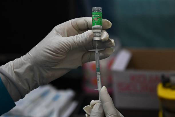 A health worker prepares a dose of the Covishield vaccine against the Covid-19 coronavirus during a vaccination drive at a community health centre in Kalwa village, about 20 km from Jind, in the northern state of Haryana on 1 June 2021.