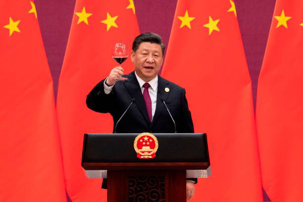 China's President Xi Jinping raises his glass and proposes a toast at the end of his speech during the welcome banquet for leaders attending the Belt and Road Forum at the Great Hall of the People in Beijing on 26 April 2019.
