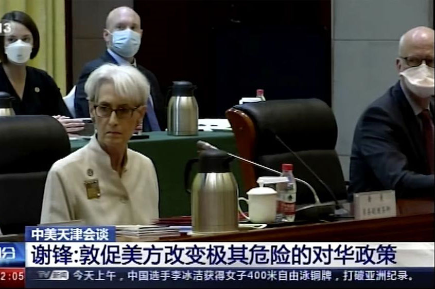 In this image taken from a video footage run by China's CCTV via AP Video, US Deputy Secretary of State Wendy Sherman, front left, and her delegation meet Chinese counterpart in Tianjin, China, on 26 July 2021. China blamed the US for what it called a “stalemate” in bilateral relations as high-level face-to-face talks began Monday.