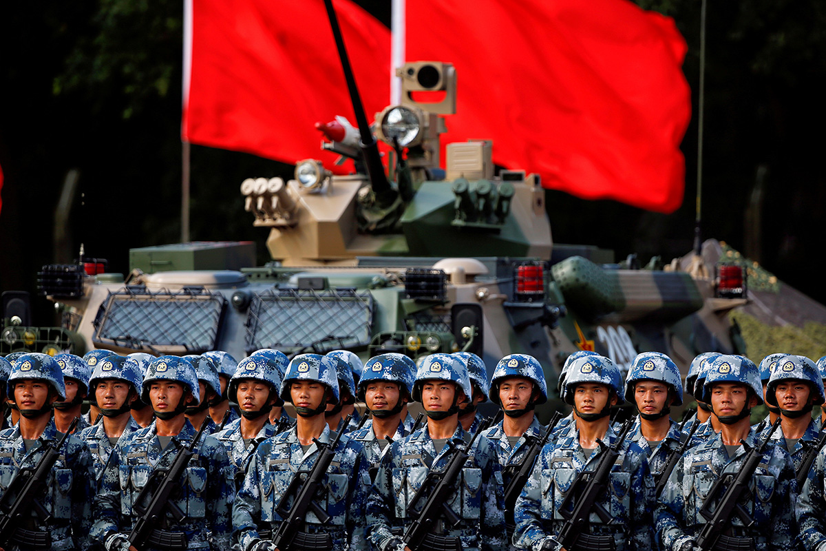 Troops prepare for the arrival of Chinese President Xi Jinping (unseen) at the People's Liberation Army (PLA) Hong Kong Garrison at one of the events marking the 20th anniversary of the city's handover from British to Chinese rule, in Hong Kong, China, on 30 June 2017.