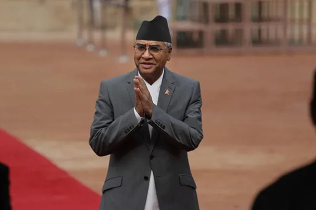 In this 24 August 2017 file photo, then Nepalese Prime Minister Sher Bahadur Deuba greets Indian ministers during his ceremonial reception at the Indian presidential palace in New Delhi, India. Deuba, a veteran politician was appointed Nepal's prime minister for the fifth time on Tuesday, 13 July 2021, a day after the Supreme Court reinstated the House of Representatives and upheld his claim to be the new leader.