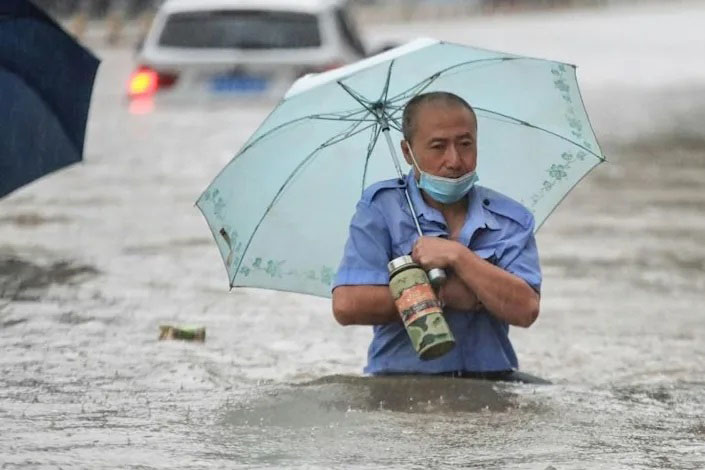 Record rainfall flooded the city of Zhengzhou, killing 12 people and submerging the subway system.