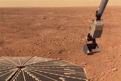 Phoenix Mars Lander excavating a sample of Martian soil