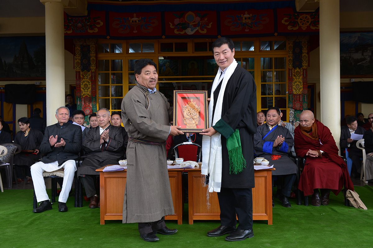 Central Tibetan Administration President Lobsang Sangay (right) presents a souvenir to the Chief Executive Councillor of Ladakh Autonomous Hill Development Council Gyal P Wangyal on the occasion of the 30th anniversary of conferment of Nobel Peace Prize on Tibetan spiritual leader the Dalai Lama, in McLeod Ganj, India, on 10 December 2019.
