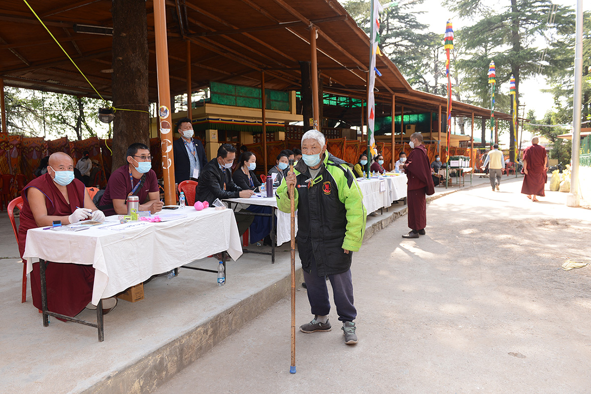 An elderly Tibetan Sonam Lhundup, 77, leave a polling station after casting his ballot to elect a new Sikyong, the political leader, and 45 members of parliament in McLeod Ganj, India, on 11 April 2021.